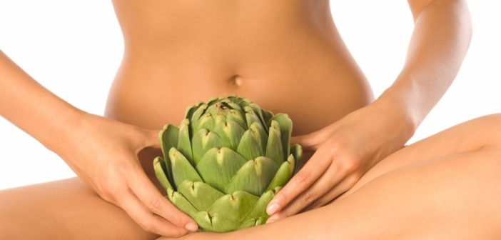 Young Nude Woman Holding Artichoke in Lap