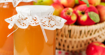 Canned Apple Juice and Apples in Basket