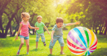 little_girl_and_boys_playing_with_ball