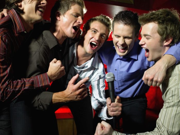 Men singing in a bar